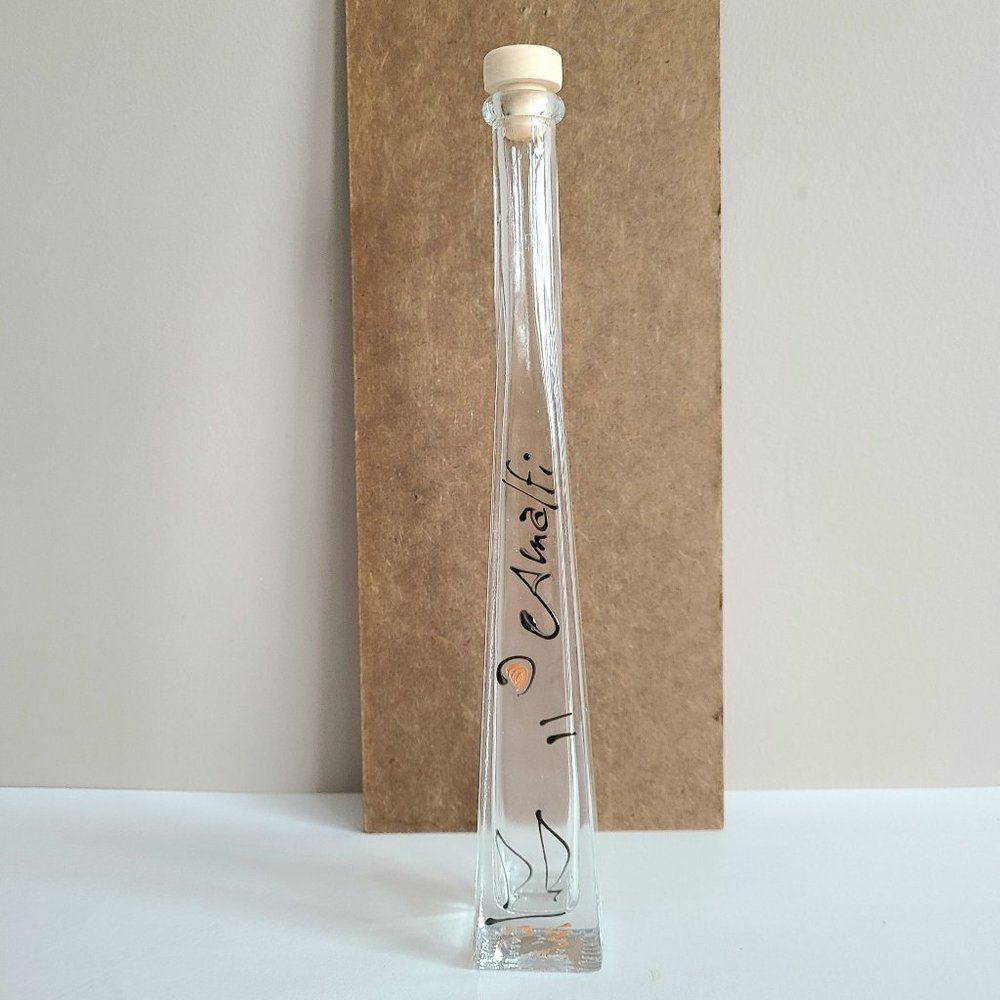 Amalfi empty clear glass bottle with stopper.